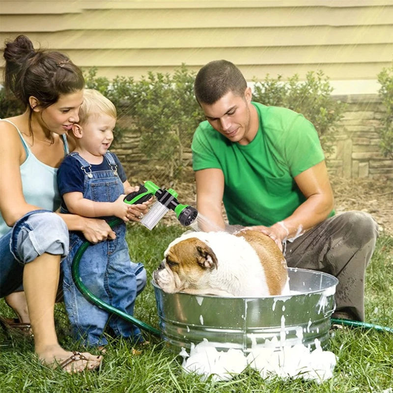 Family with a child and a dog in a outdoor setting, washing the dog in a tub.